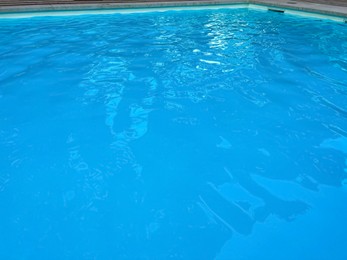 Photo of Closeup view of hotel swimming pool as background. Time for relax