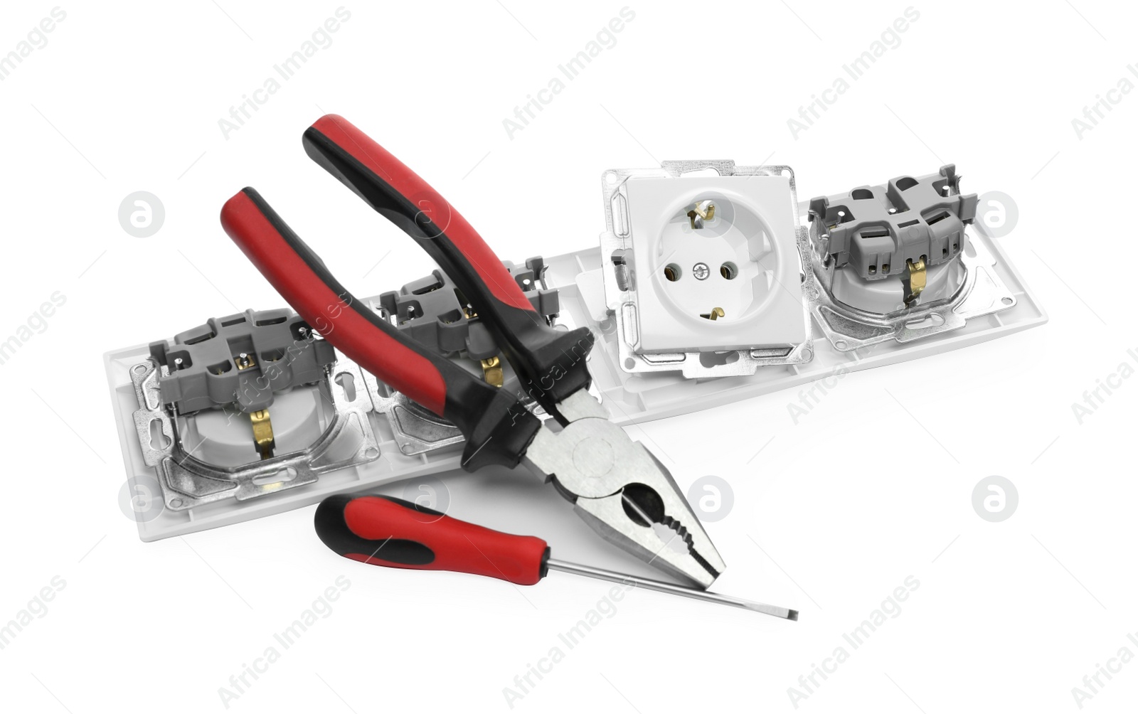 Photo of Set of sockets and electrician's tools isolated on white