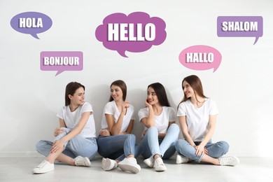 Image of Happy women sitting near light wall and illustration of speech bubbles with word Hello written in different languages