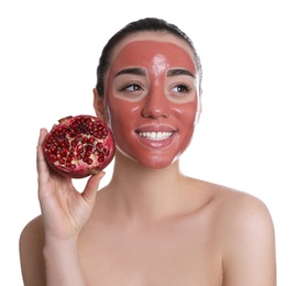 Photo of Woman with pomegranate face mask and fresh fruit on white background