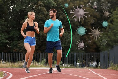 Image of Sporty couple running outdoors. Healthy lifestyle - base of strong immunity