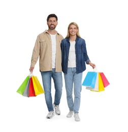 Family shopping. Happy couple with many colorful bags on white background