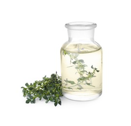 Photo of Bottle of thyme essential oil and fresh plant isolated on white