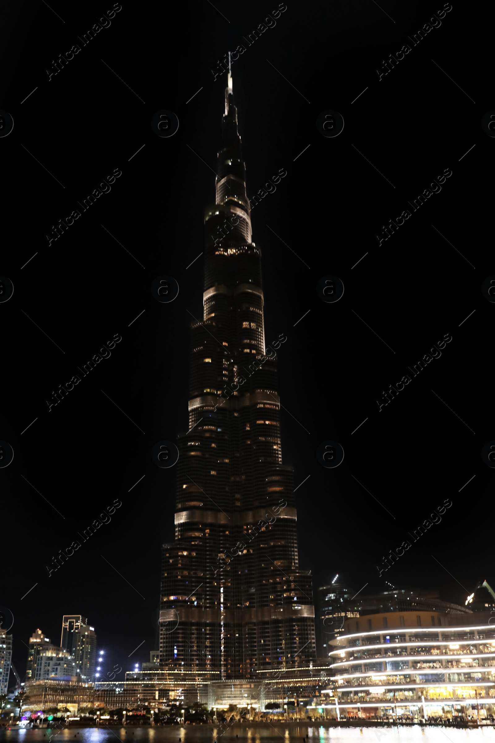 Photo of DUBAI, UNITED ARAB EMIRATES - NOVEMBER 04, 2018: Night cityscape with world tallest building Burj Khalifa