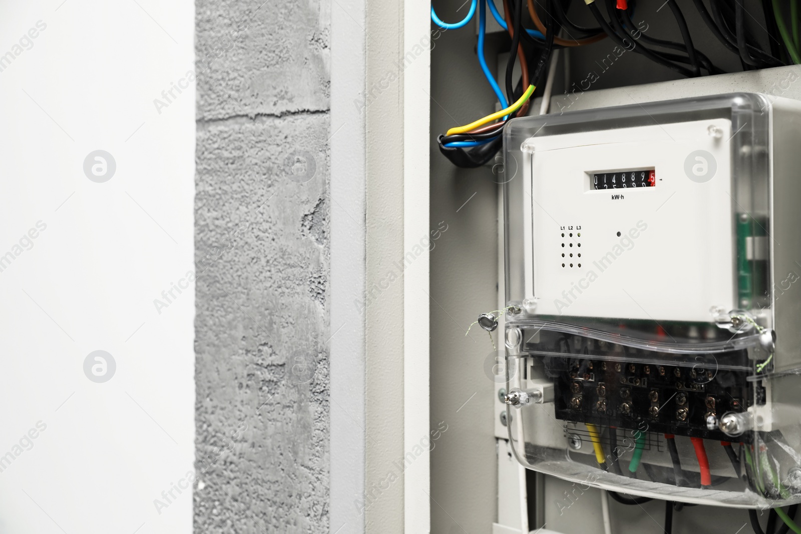 Photo of Electric meter and wires in fuse box, space for text