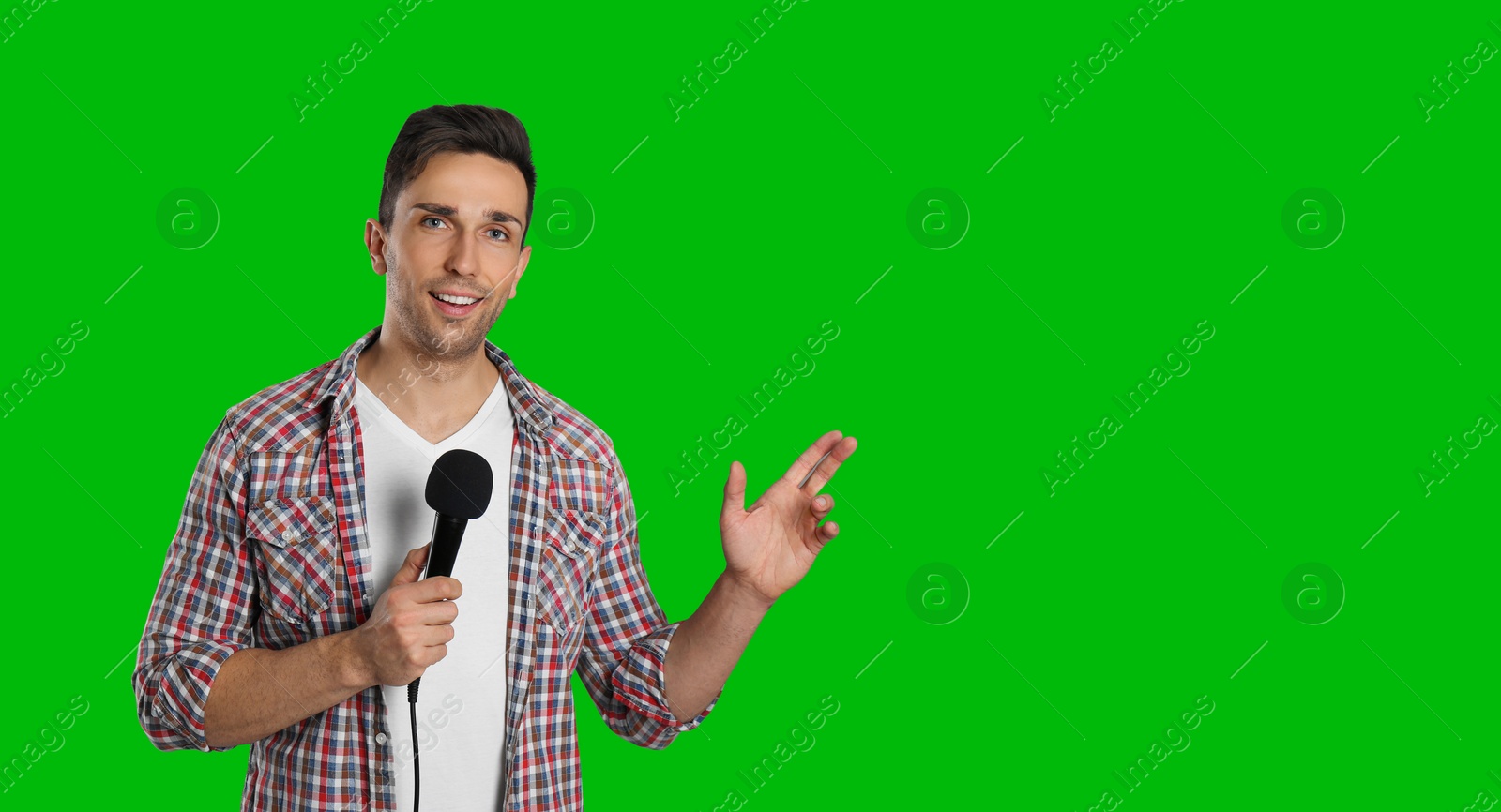 Image of Chroma key compositing. Broadcaster with microphone against green screen, banner design