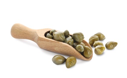 Photo of Wooden scoop and capers on white background