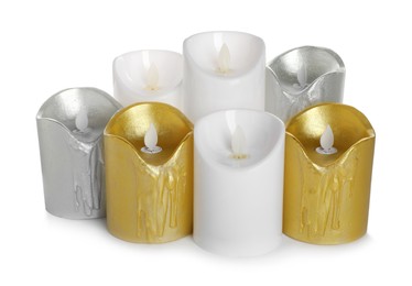 Photo of Different decorative flameless LED candles on white background
