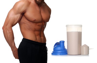 Image of Bodybuilding. Man with muscular torso, protein powder and shaker isolated on white