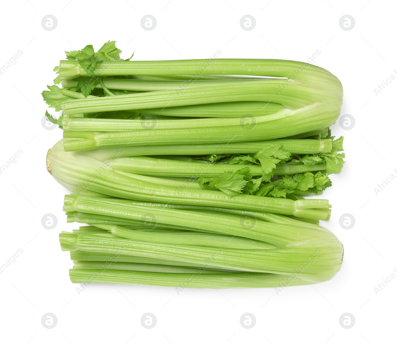 Photo of Fresh green celery bunches isolated on white, top view