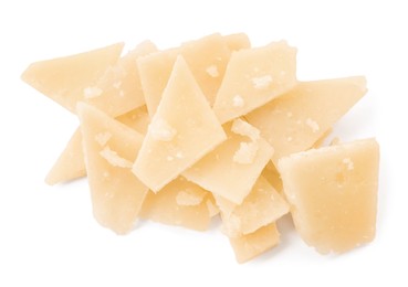 Pile of parmesan cheese pieces on white background, top view