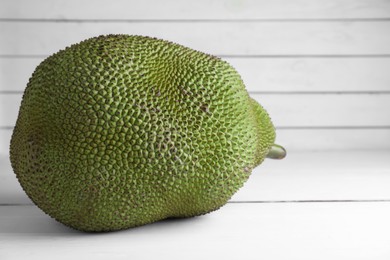 Photo of Delicious fresh exotic jackfruit on white table