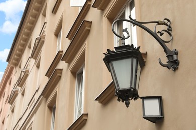 Photo of Vintage street lamp on wall of building