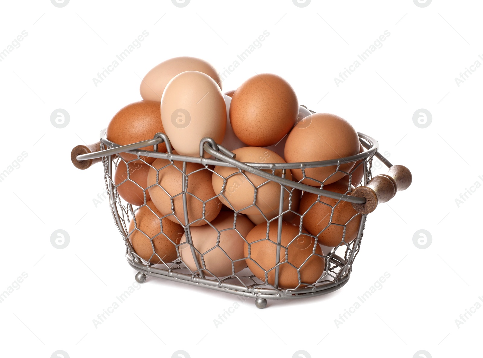 Photo of Fresh chicken eggs in metal basket isolated on white