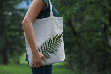 Photo of Woman with eco bag outdoors. Mockup for design