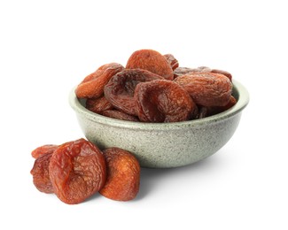 Photo of Ceramic bowl with tasty dried apricots isolated on white