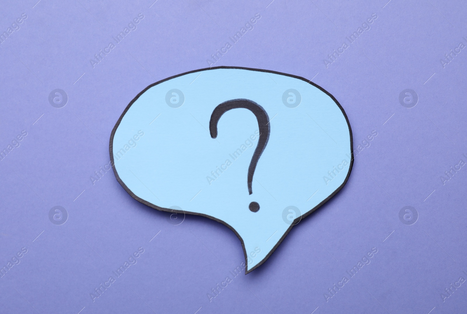 Photo of Paper speech bubble with question mark on violet background, top view