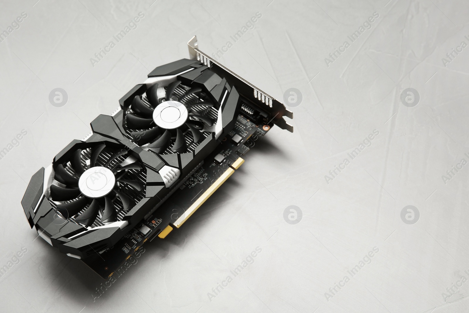Photo of Computer graphics card on gray textured background, space for text
