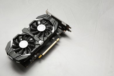 Computer graphics card on gray textured background, space for text