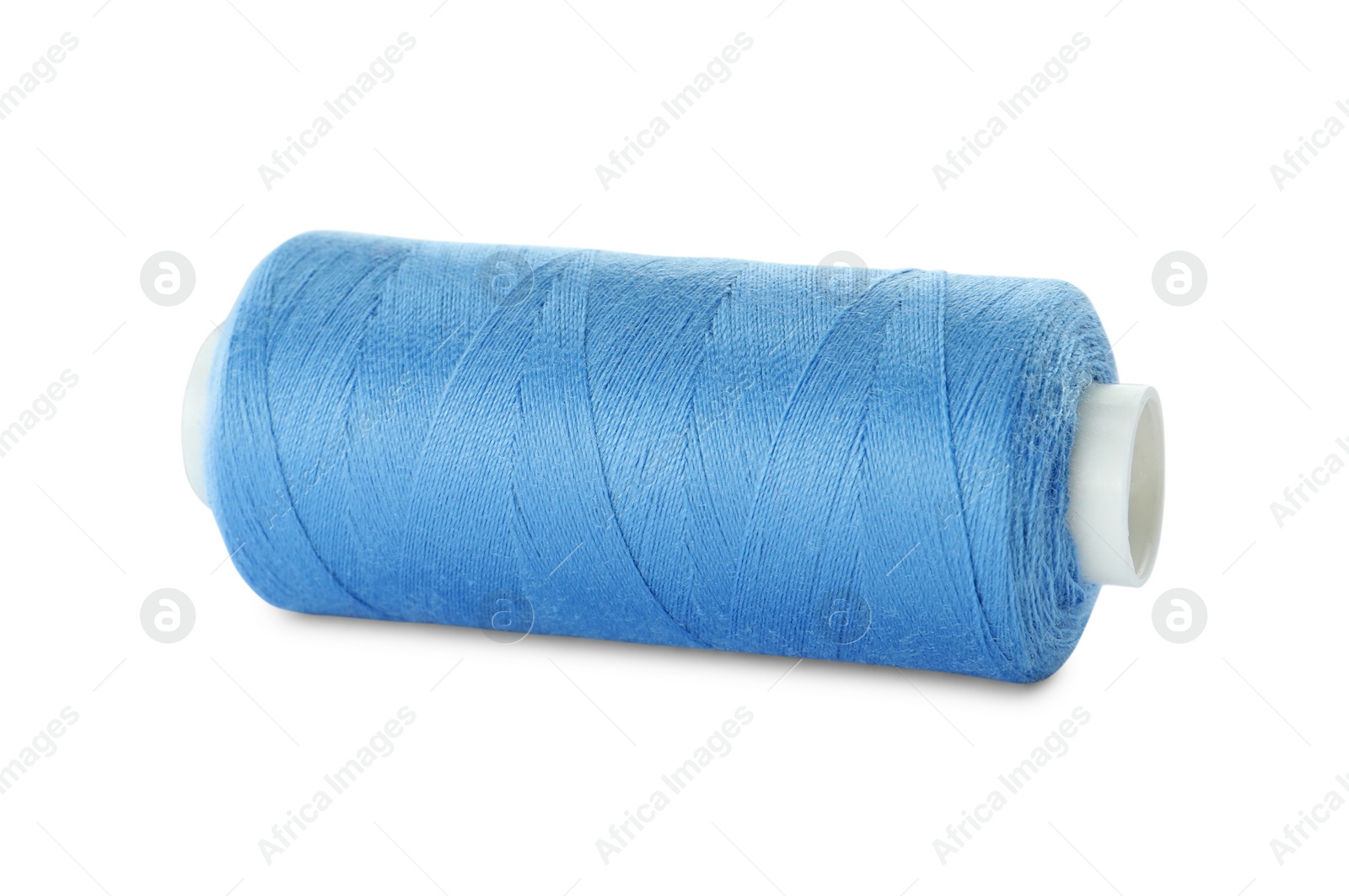 Photo of Spool of light blue sewing thread isolated on white