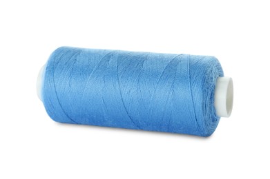 Photo of Spool of light blue sewing thread isolated on white