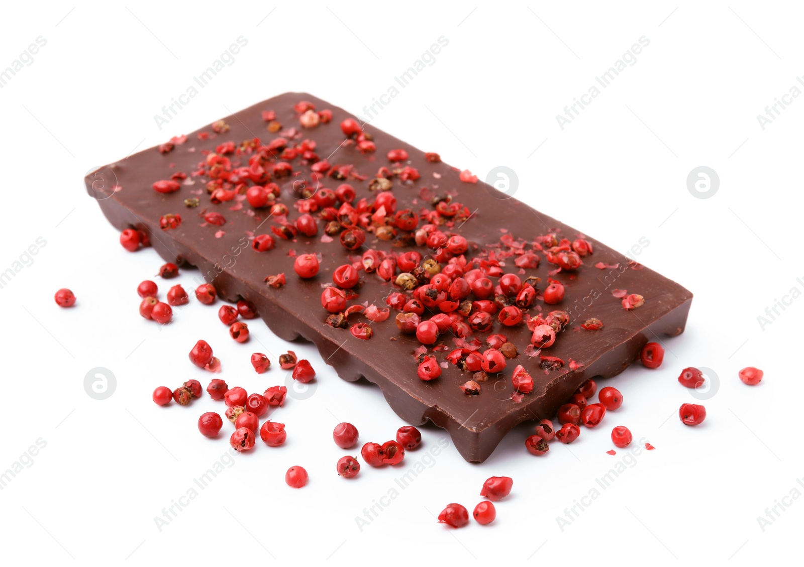 Photo of Dark chocolate bar with red peppercorns isolated on white