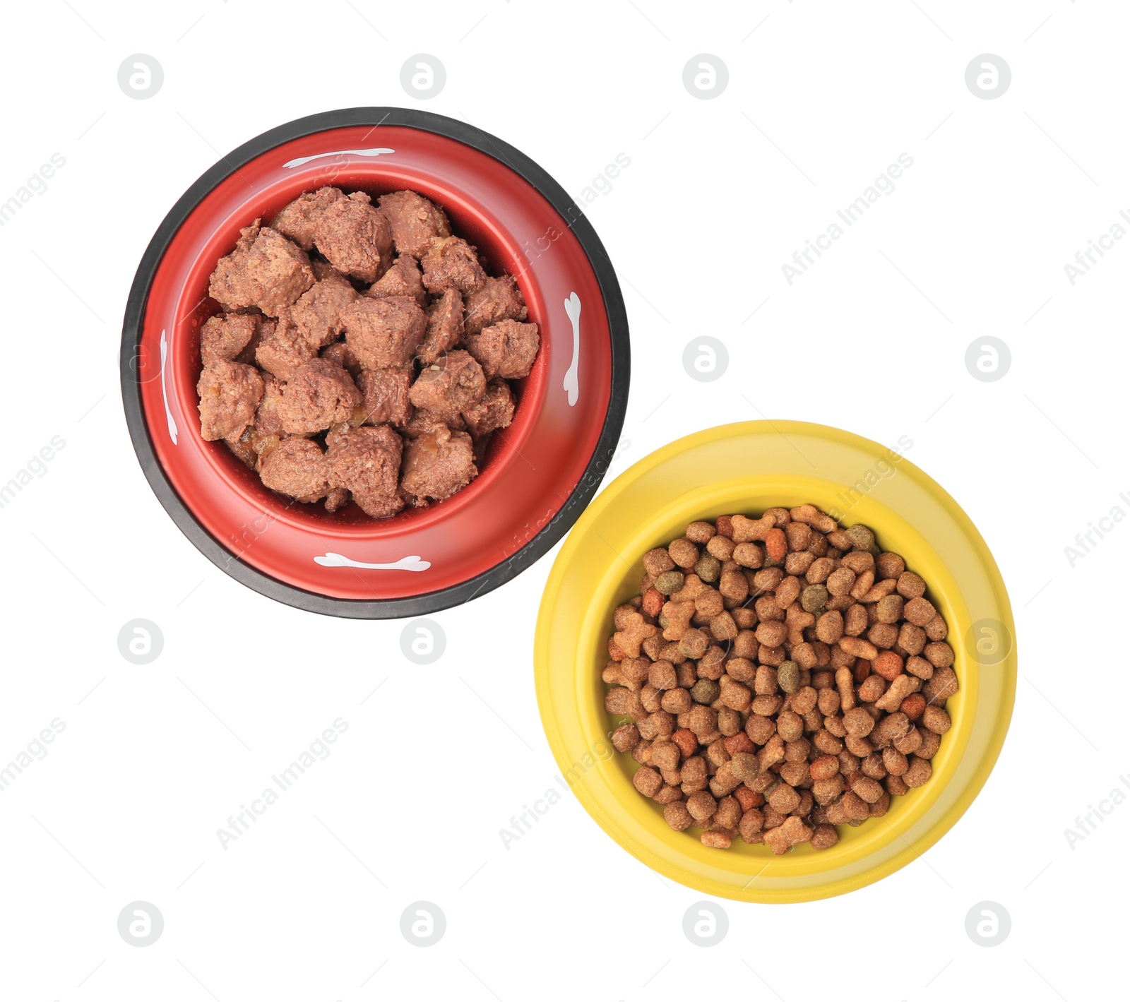 Photo of Dry and wet pet food in feeding bowls isolated on white, top view