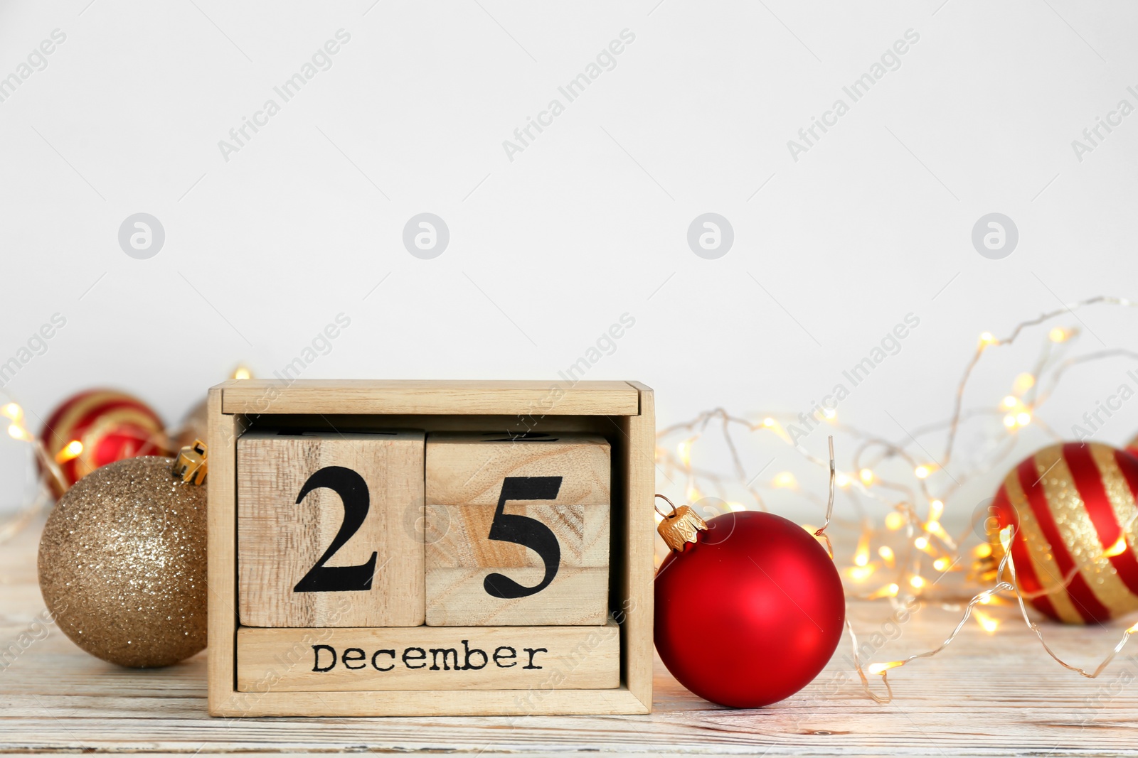 Photo of Wooden block calendar and decor on table. Christmas countdown