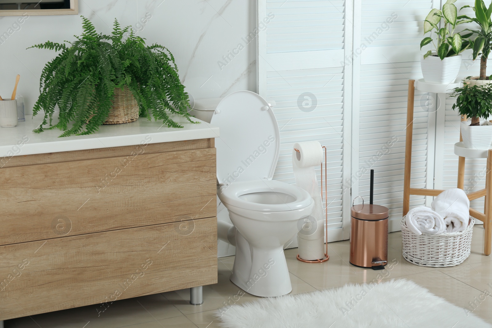 Photo of Stylish toilet bowl in modern bathroom interior