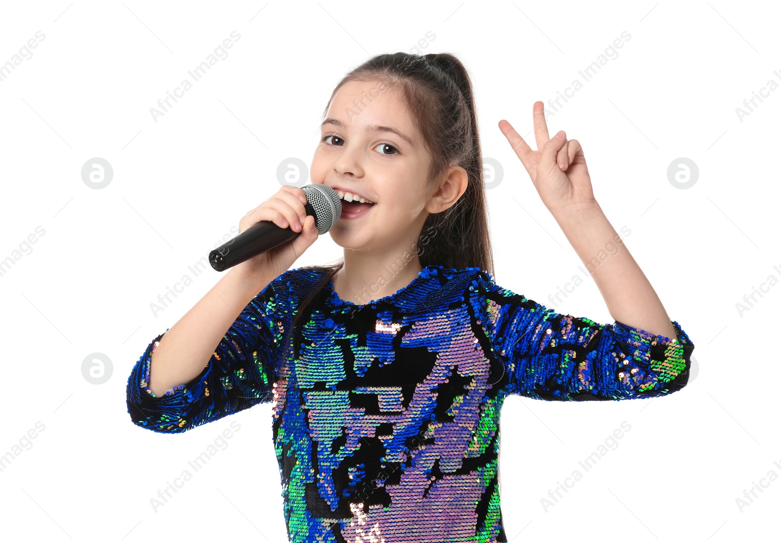 Photo of Little girl singing into microphone on white background