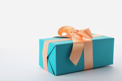 Photo of Beautiful gift box with ribbon on white background