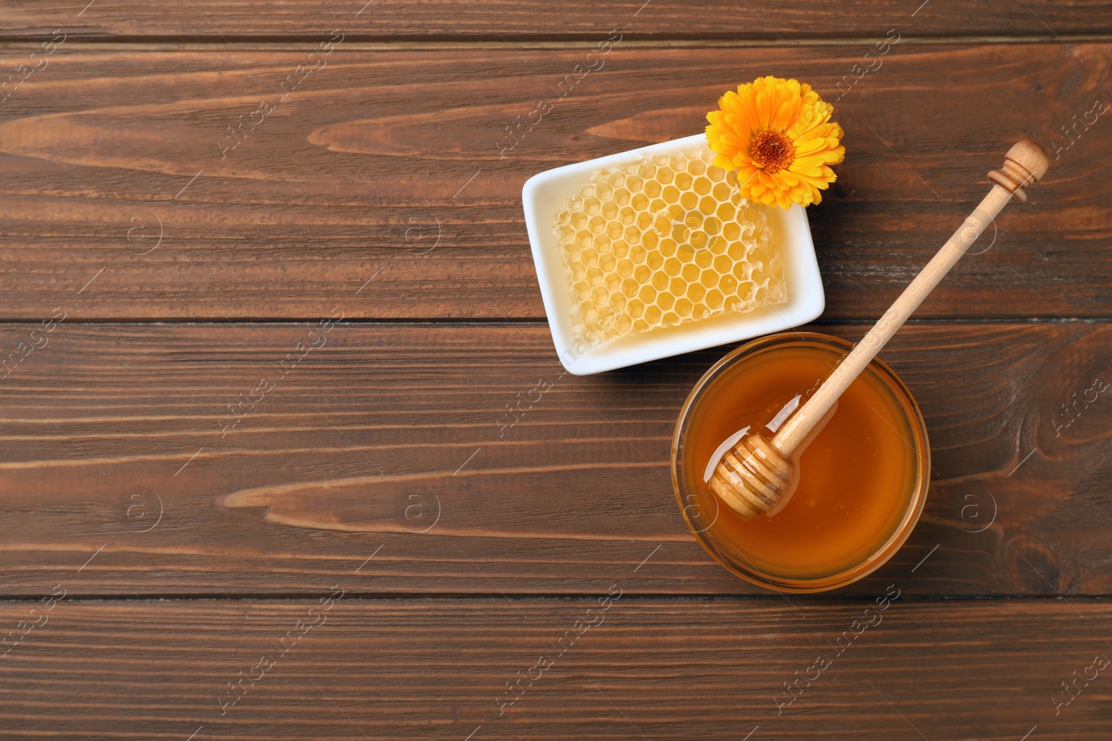 Photo of Flat lay composition with fresh honey on wooden background