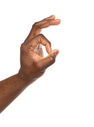 African-American man showing OK gesture on white background, closeup