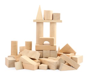 Photo of Building made of wooden blocks isolated on white. Children's toys