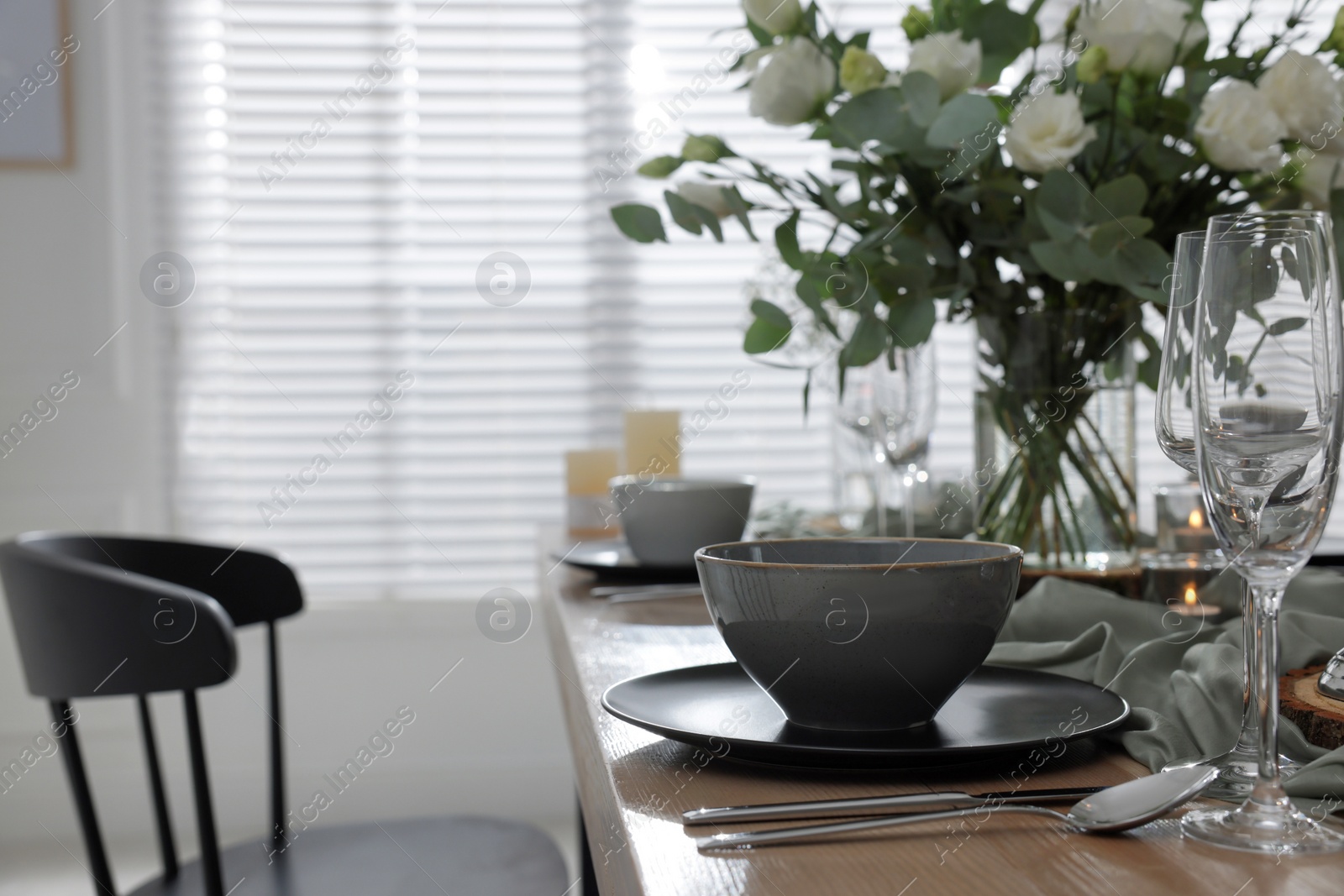 Photo of Festive table setting with beautiful tableware and decor indoors