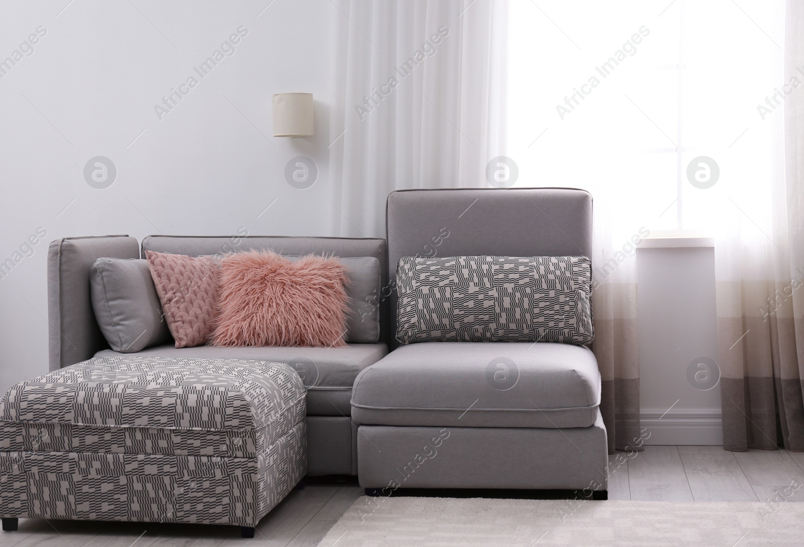 Photo of Modern living room interior with comfortable sofa near window