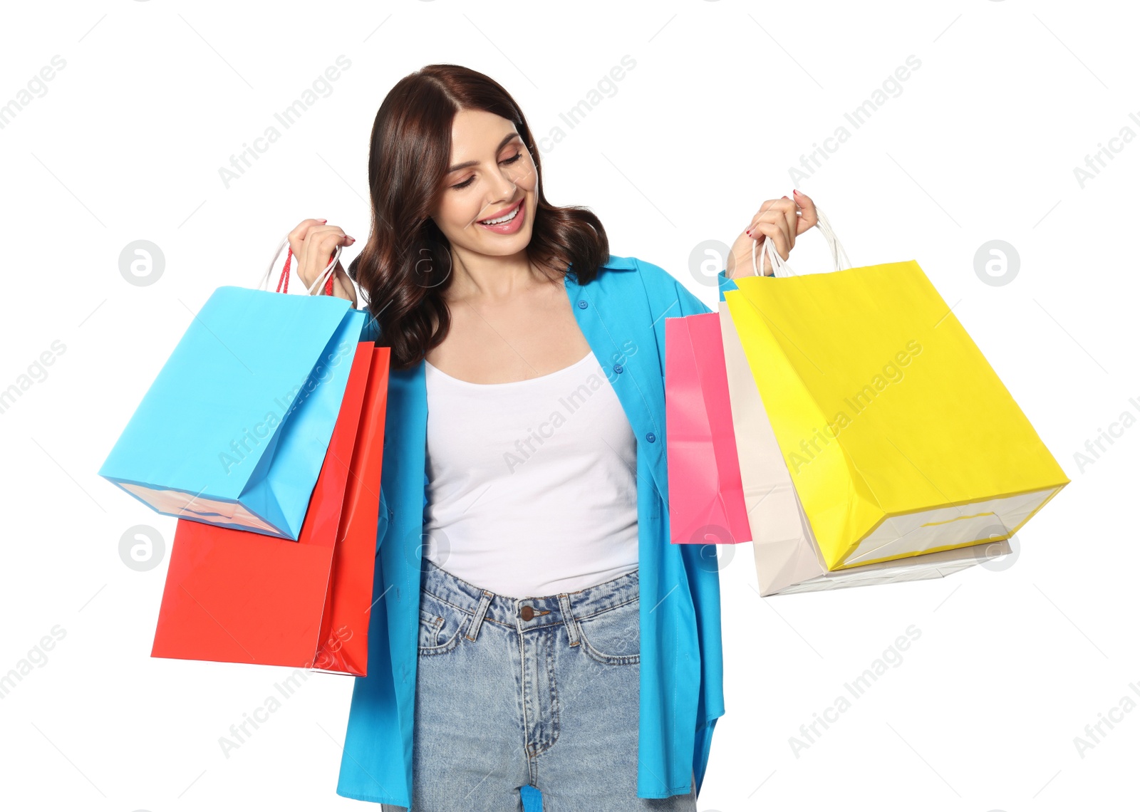 Photo of Beautiful young woman with paper shopping bags on white background