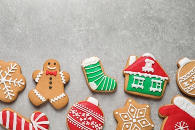 Flat lay composition with tasty homemade Christmas cookies on grey table, space for text