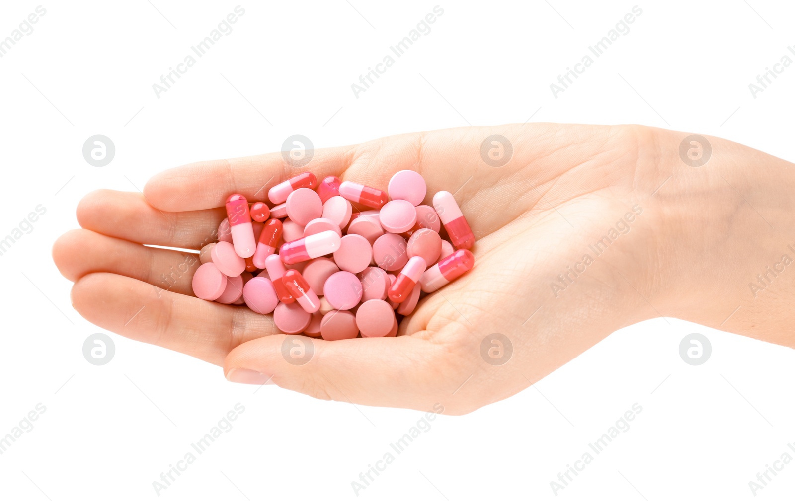 Photo of Woman holding color pills on white background, closeup