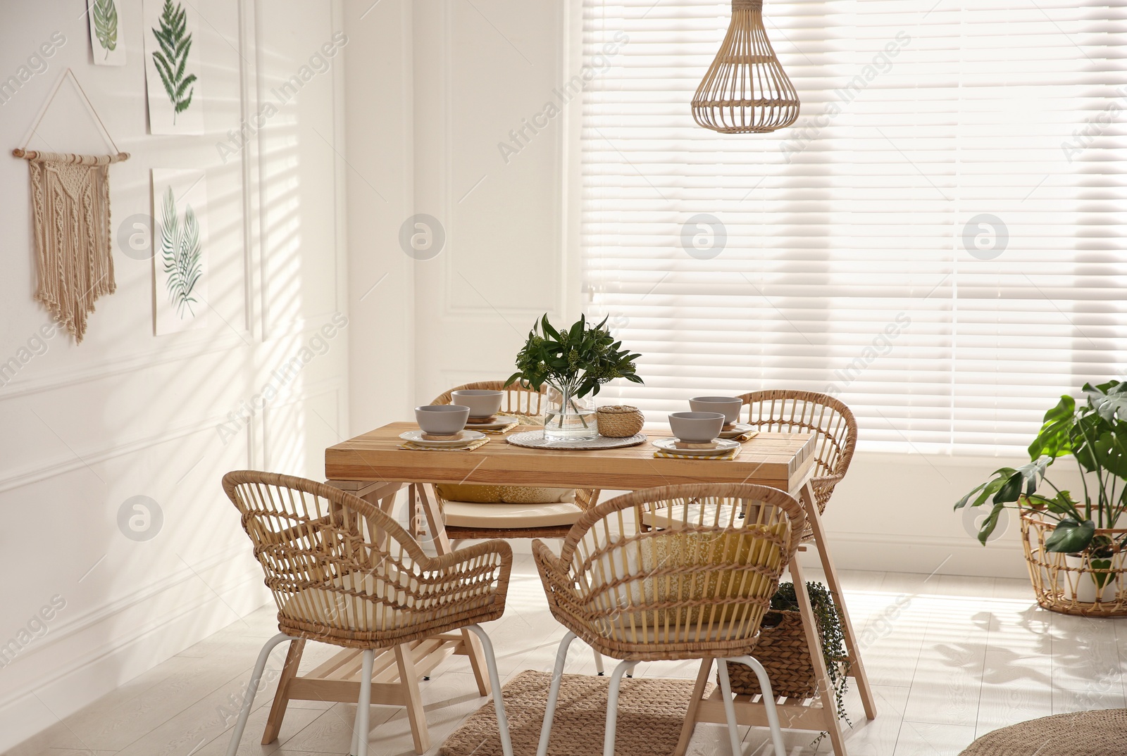 Photo of Stylish wooden dining table and chairs in room. Interior design