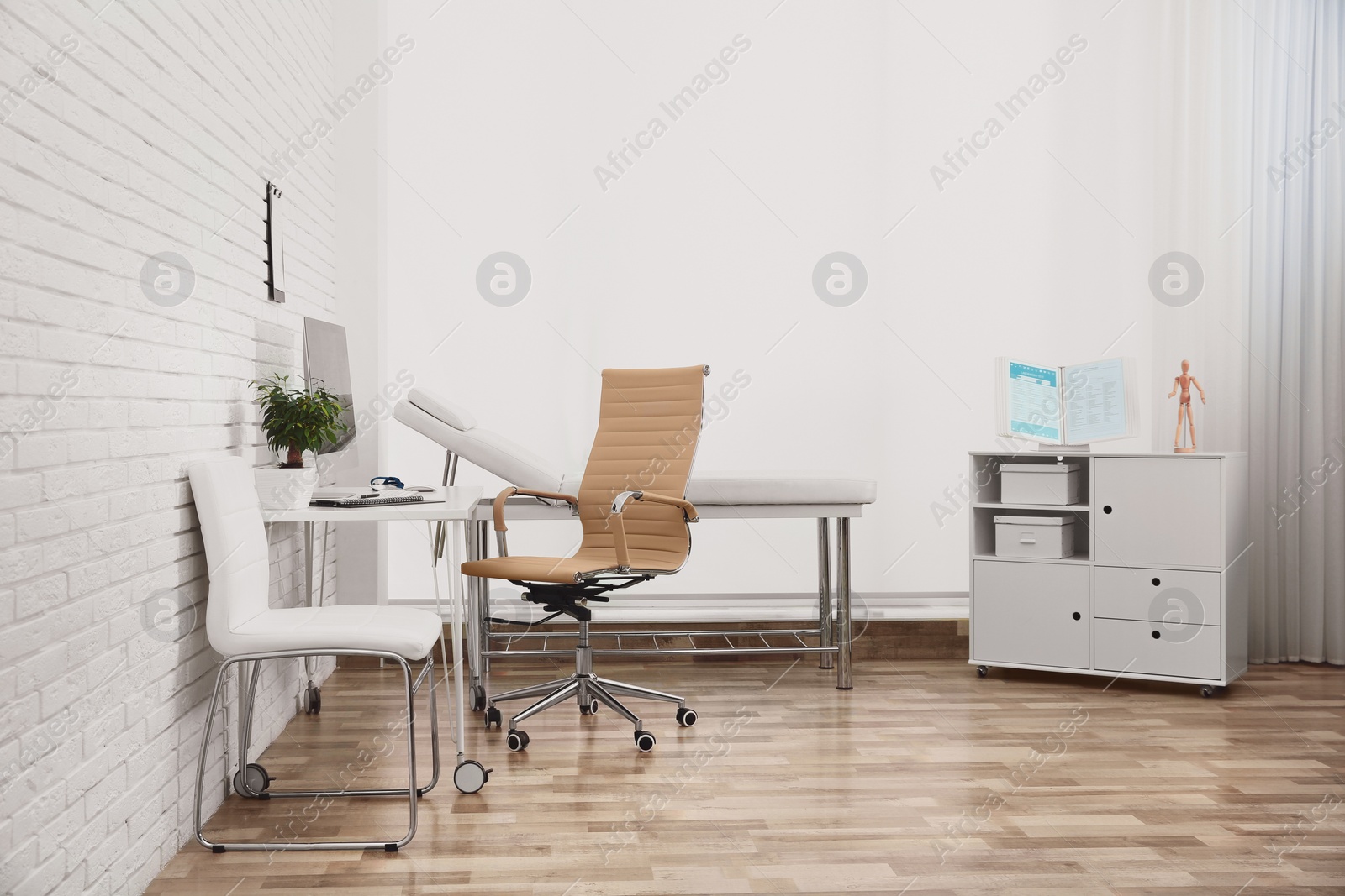 Photo of Interior of modern medical office. Doctor's workplace