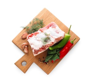 Photo of Piece of pork fatback served with different ingredients isolated on white, top view