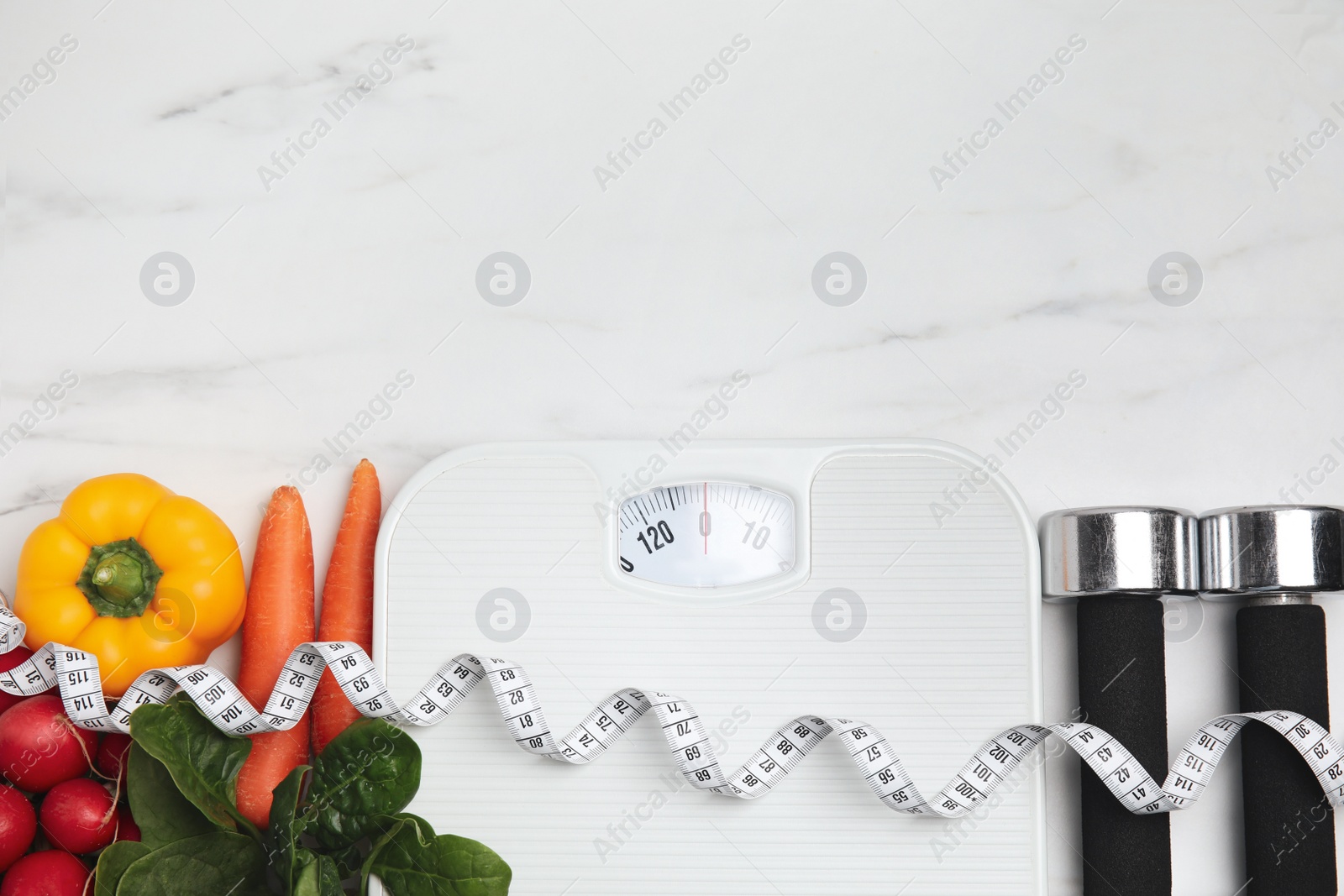 Flat lay composition with scales and vegetables on white marble table, space for text Photo of Flat lay composition with scales and vegetables on white marble table, space for text