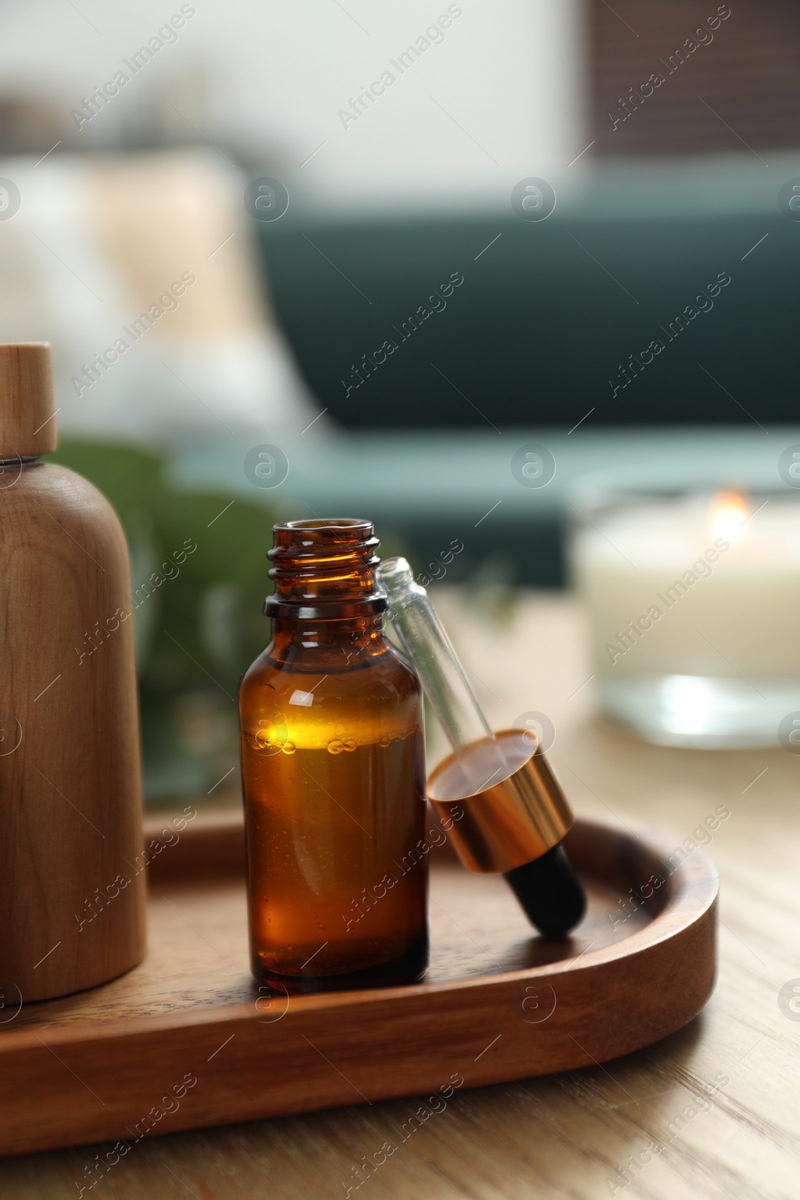 Photo of Aromatherapy. Bottles of essential oil on wooden table