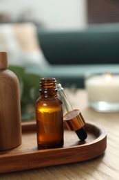 Aromatherapy. Bottles of essential oil on wooden table