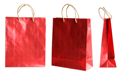 Image of Set of paper shopping bags on white background