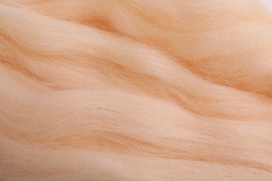 Soft felting wool as background, closeup view