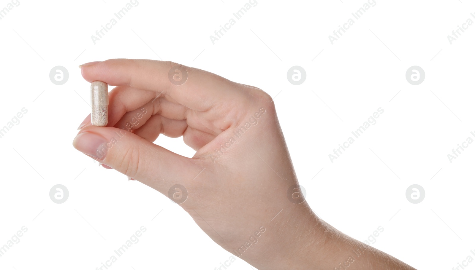 Photo of Woman holding gelatin capsule on white background, closeup