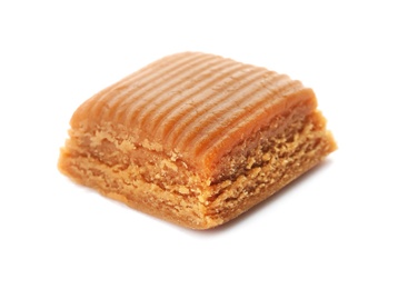 Photo of Delicious caramel candy on white background