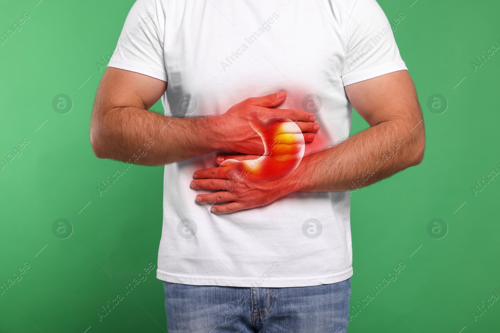 Image of Man suffering from abdominal pain on green background, closeup. Illustration of unhealthy stomach